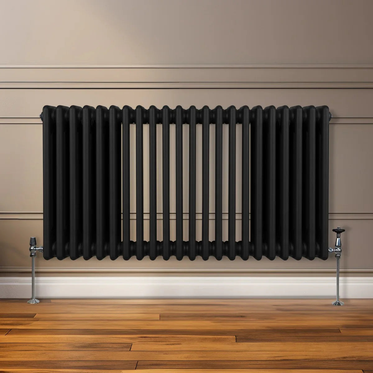 Traditional 3 column radiator in sleek black finish, featuring a ribbed design, mounted on a wall above polished wooden flooring