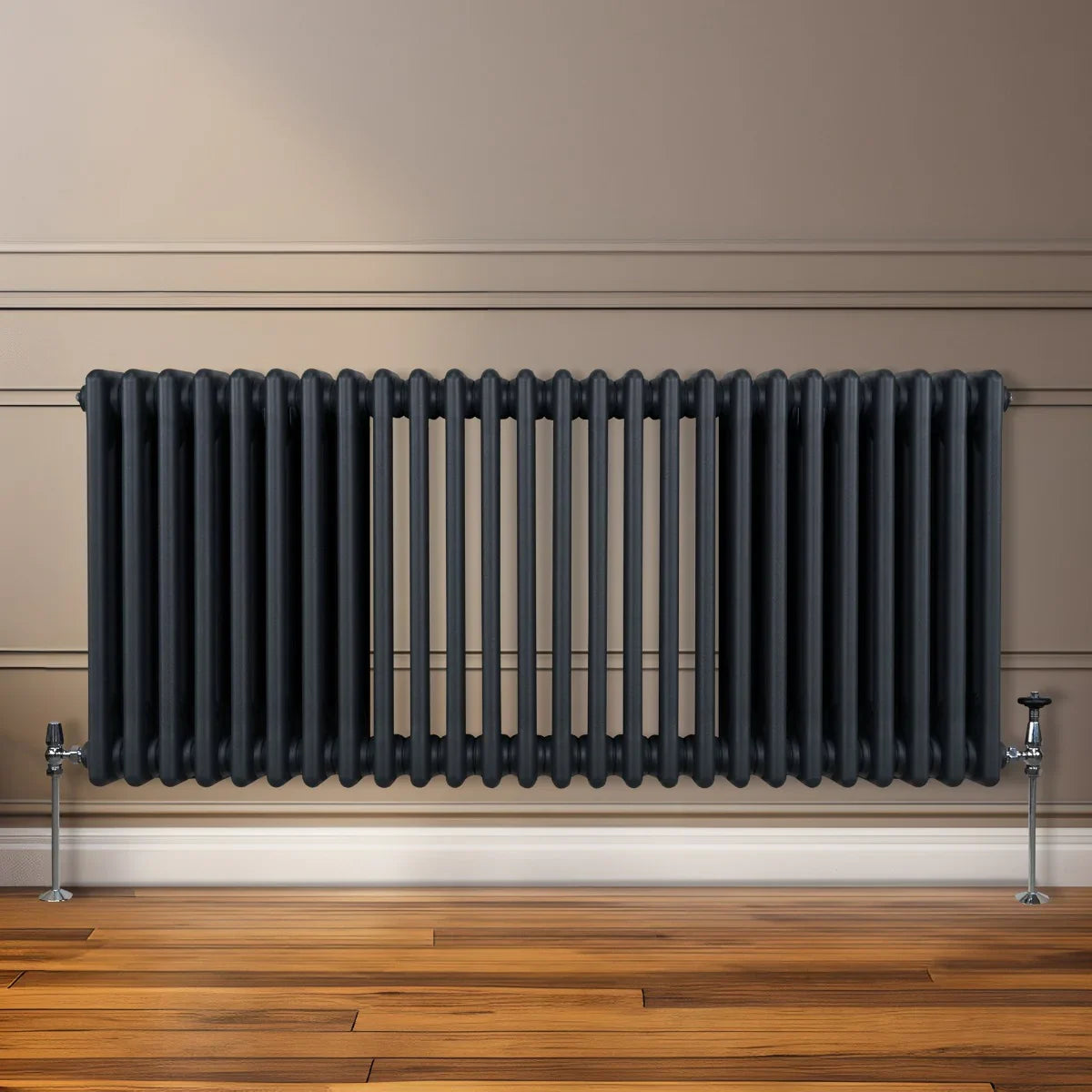 Traditional 3 column radiator in anthracite grey, featuring a sleek, ribbed design and sturdy metal legs, set against a neutral wall