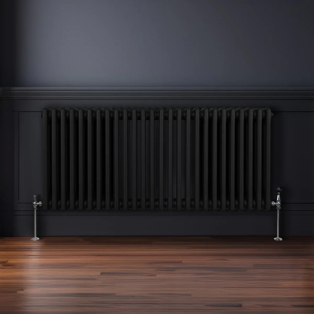 Traditional black 3 column radiator, 600 x 1192mm, featuring a sleek design with vertical bars against a dark wall and wooden floor