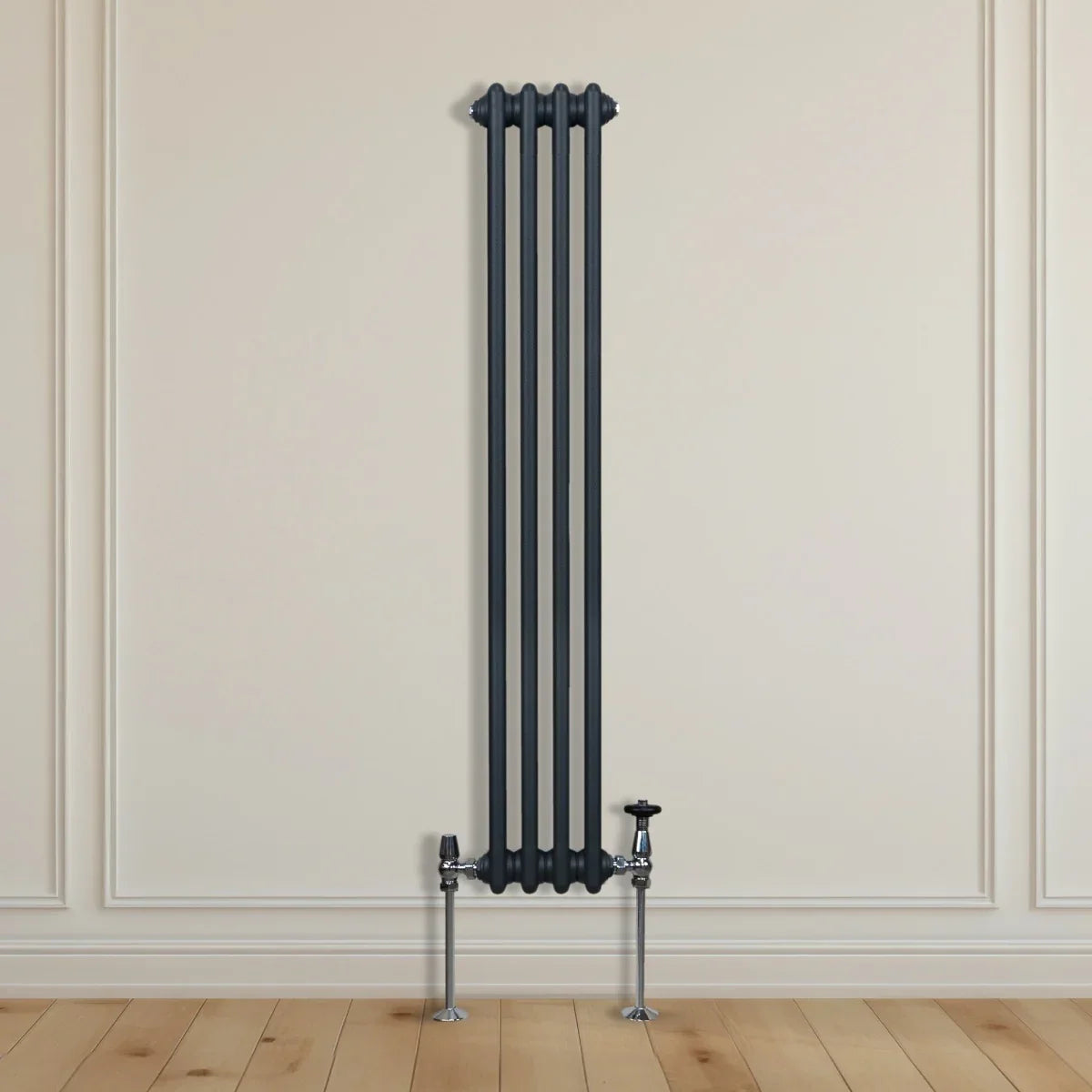 Traditional 3 column radiator in anthracite grey, featuring a sleek vertical design and polished valves, mounted on a light wall