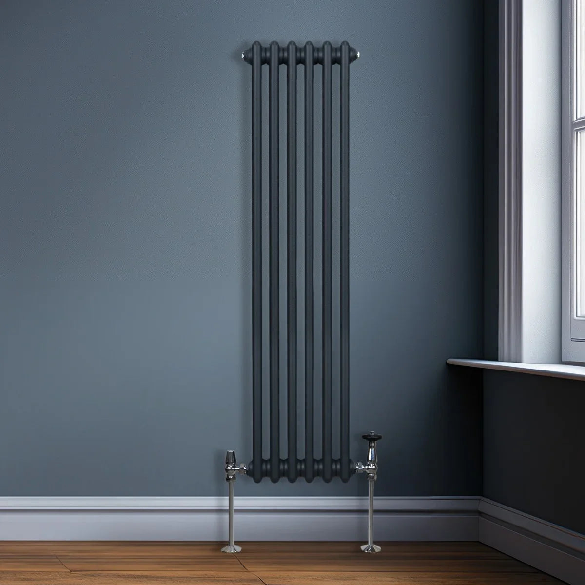 Traditional anthracite grey 3 column radiator, 1500 x 292mm, mounted on a wall with polished chrome valves and a sleek design