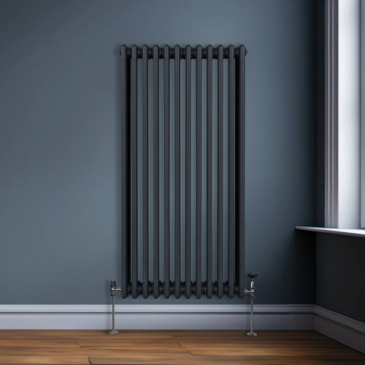 Traditional anthracite grey 3 column radiator, 1500 x 562mm, featuring a sleek design with vertical bars and polished valves against a modern interior wall