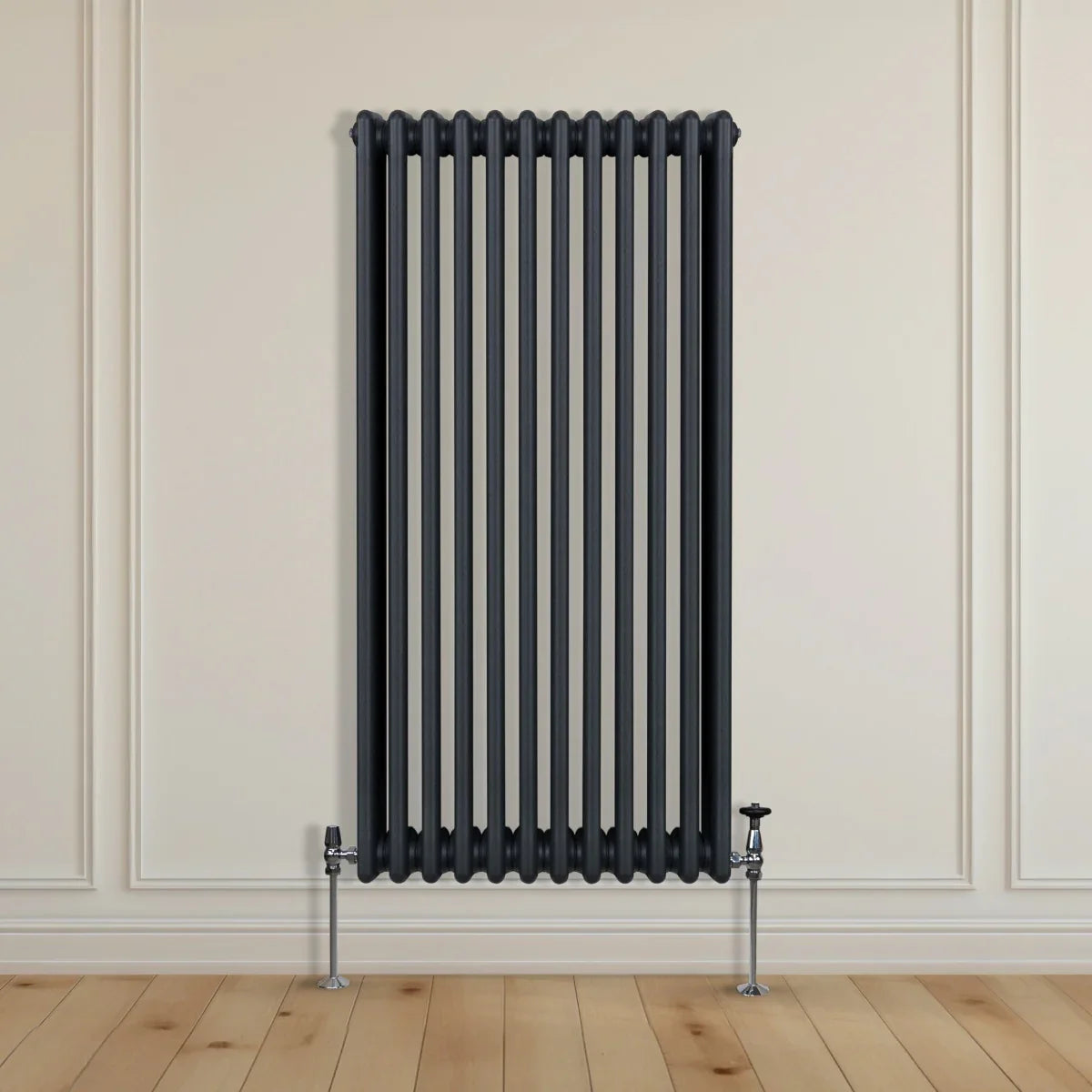 Traditional 3 column radiator in anthracite grey, featuring vertical bars and sleek design, mounted on a light wooden floor