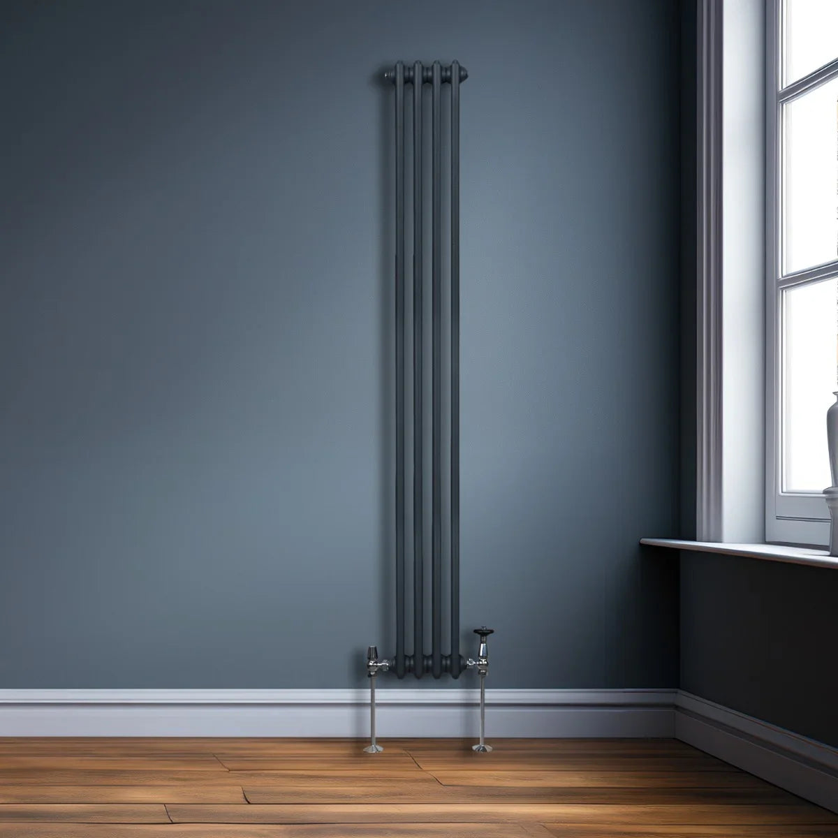 Traditional anthracite grey 3 column radiator, 1800 x 202mm, sleek vertical design against a dark blue wall, complementing wooden floor