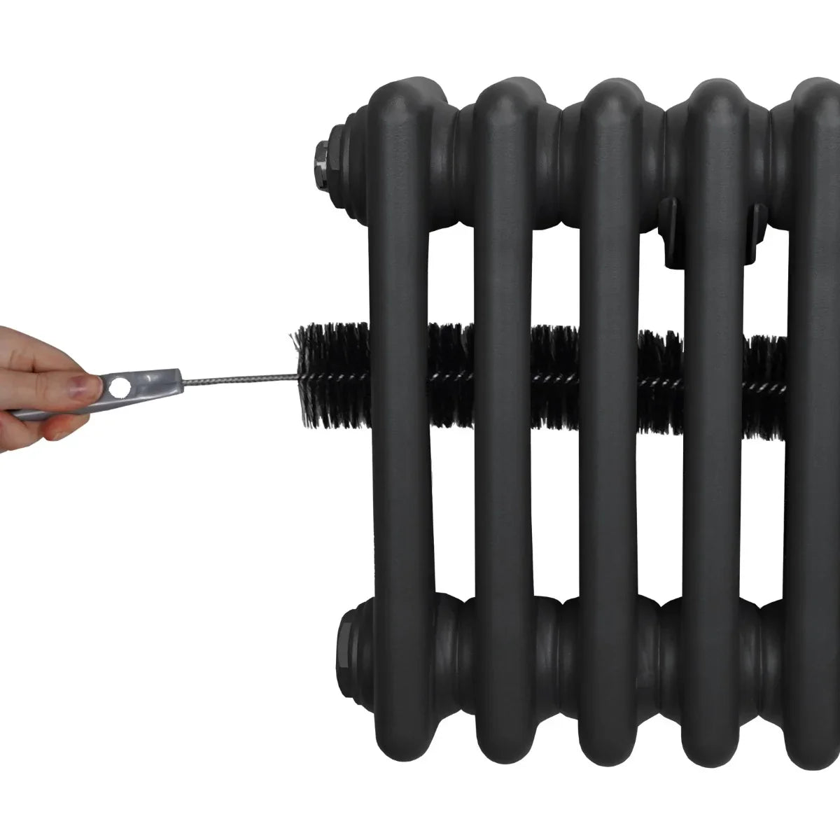 Traditional anthracite grey 3 column radiator with a hand holding a cleaning brush, showcasing its textured surface and sturdy design