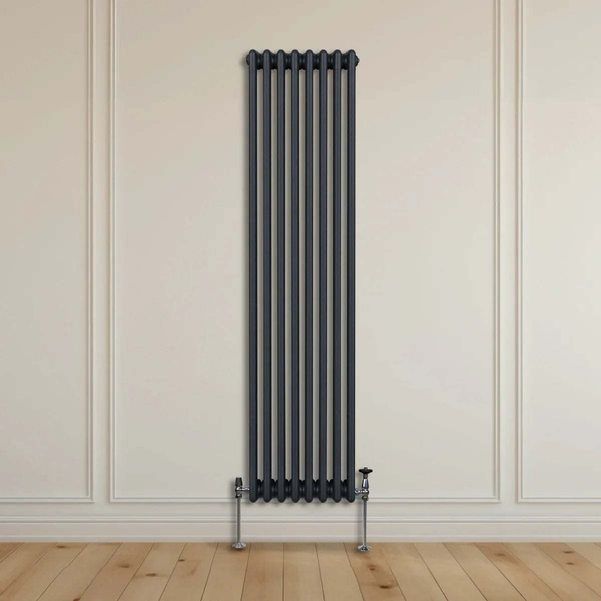 Traditional 3 column radiator in anthracite grey, 1800 x 382mm, featuring a sleek vertical design against a light wall and wooden floor