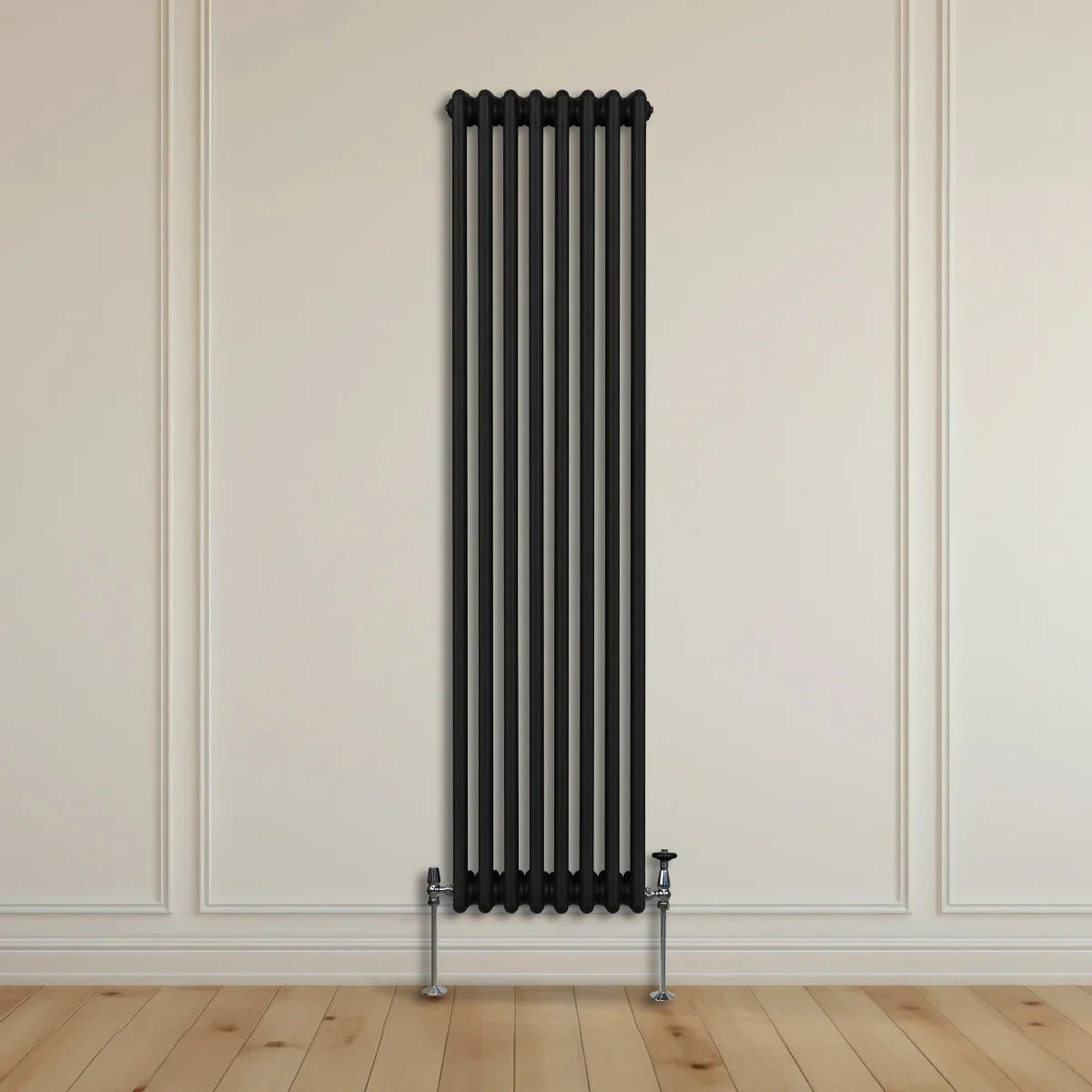 Traditional black 3 column radiator, 1800 x 382mm, featuring a sleek vertical design against a light wall and wooden floor