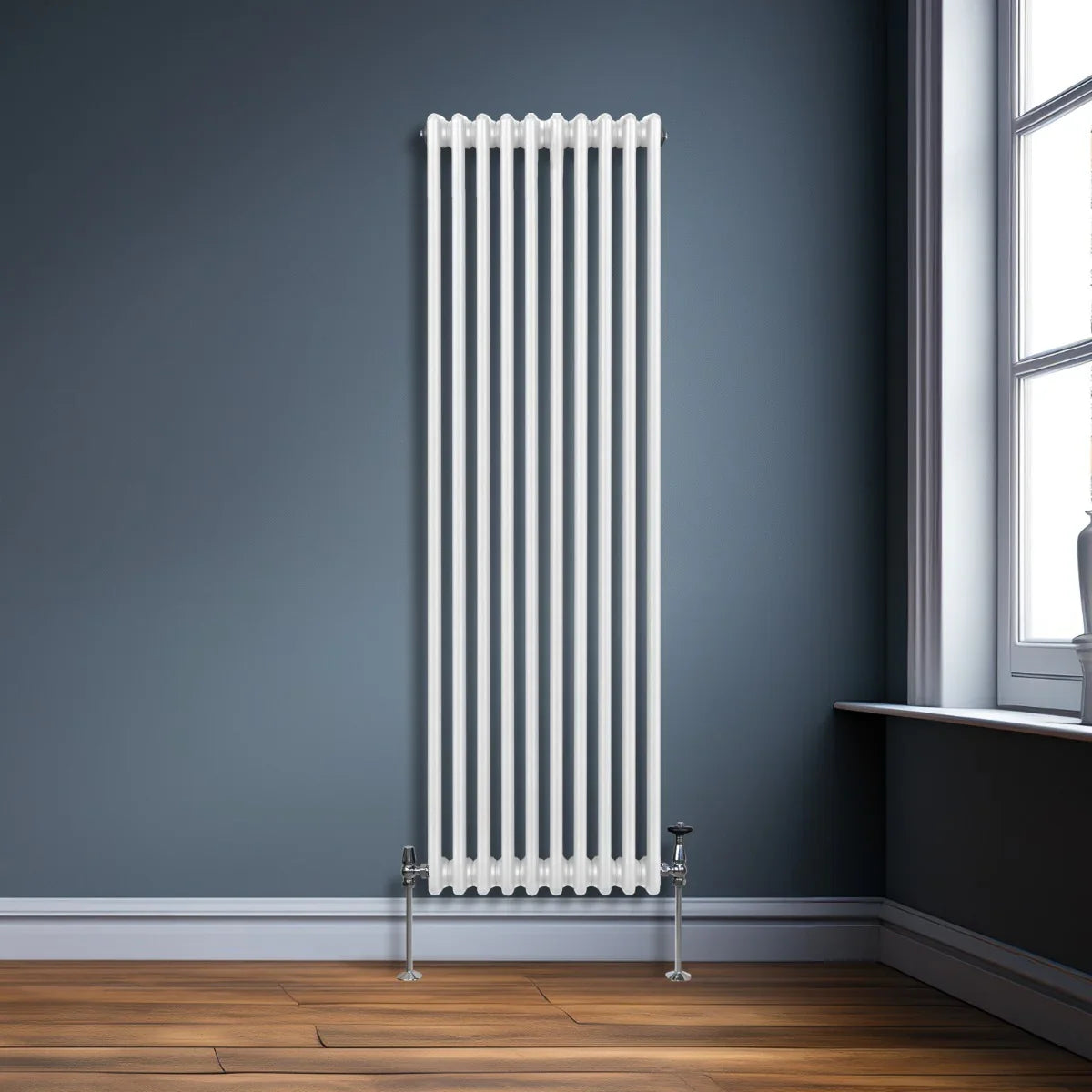 Traditional 3 column radiator in white, 1800 x 472mm, featuring a sleek vertical design against a dark blue wall and wooden floor