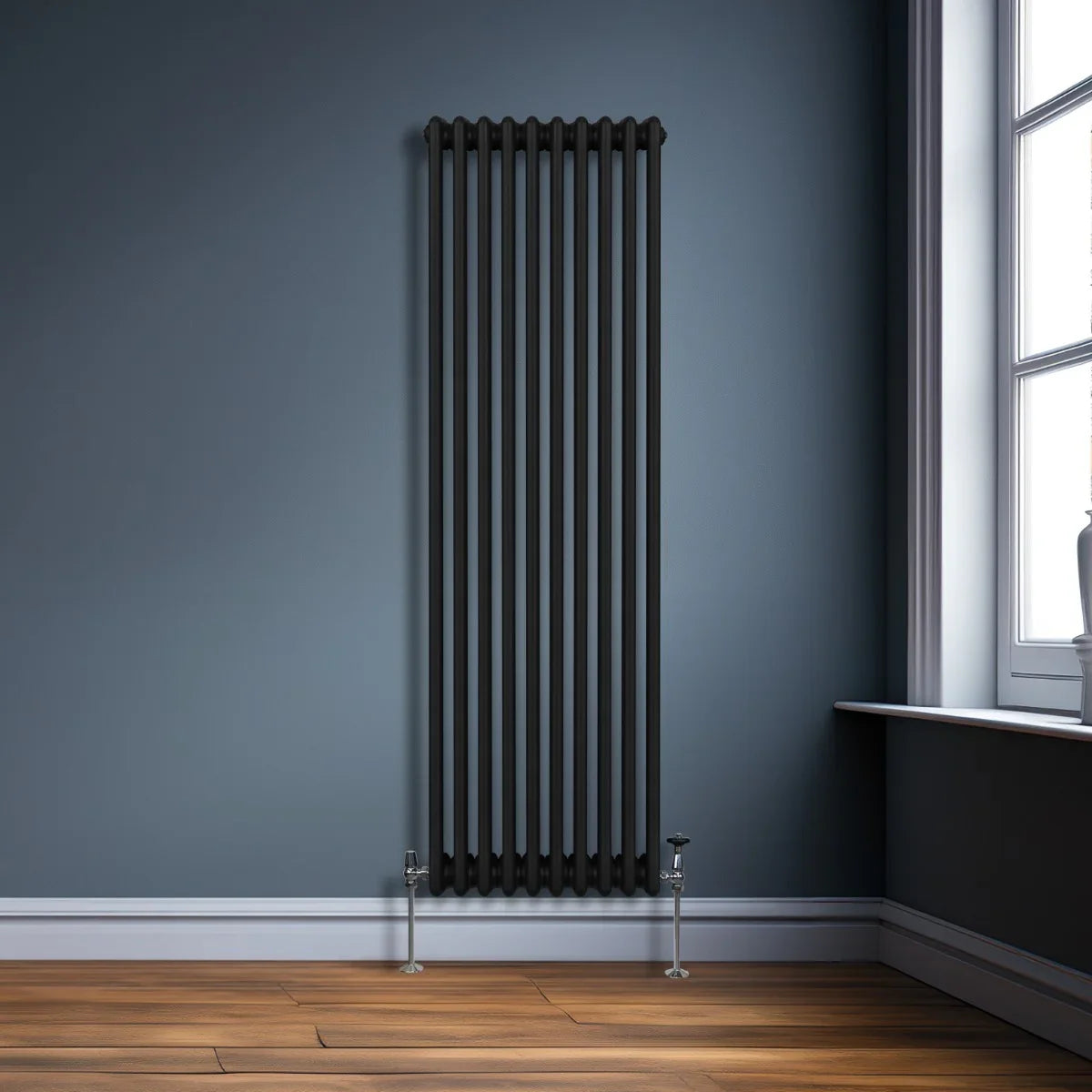 Traditional black 3 column radiator, 1800 x 472mm, featuring a sleek design with vertical lines, set against a modern room backdrop