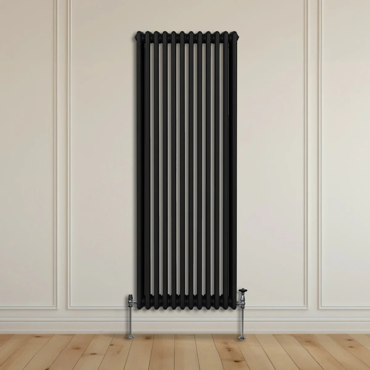 Traditional black 3 column radiator, 1800 x 562mm, featuring a sleek design with vertical lines and chrome valves, mounted on a light wooden floor
