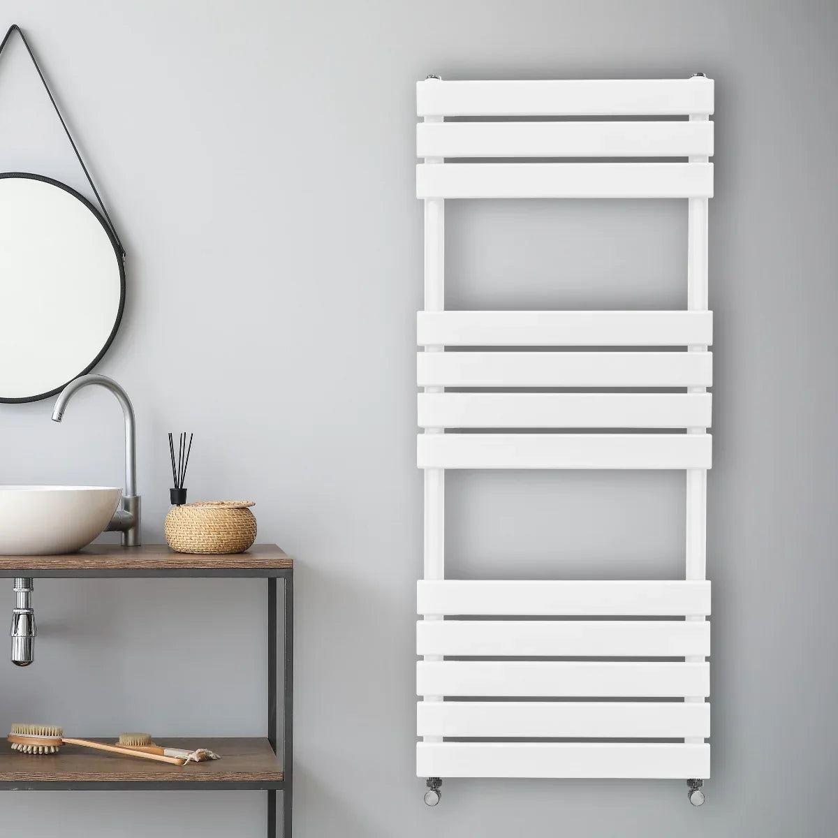 Sleek white flat panel towel radiator, 1200mm x 450mm, mounted on a gray wall, featuring horizontal slats and a modern design
