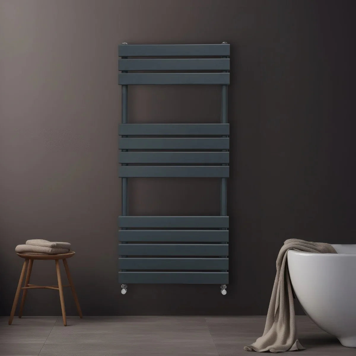 Flat panel towel radiator in anthracite grey, featuring sleek horizontal slats, mounted on a dark wall, with a soft towel draped nearby