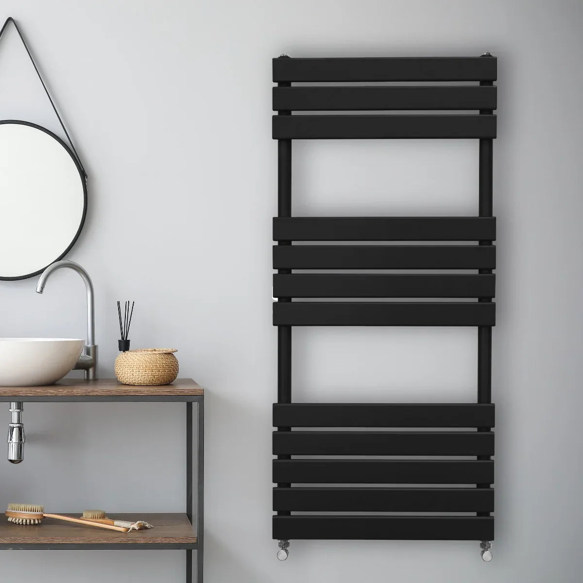 Sleek black flat panel towel radiator mounted on a wall, featuring horizontal slats and a modern design, perfect for any bathroom