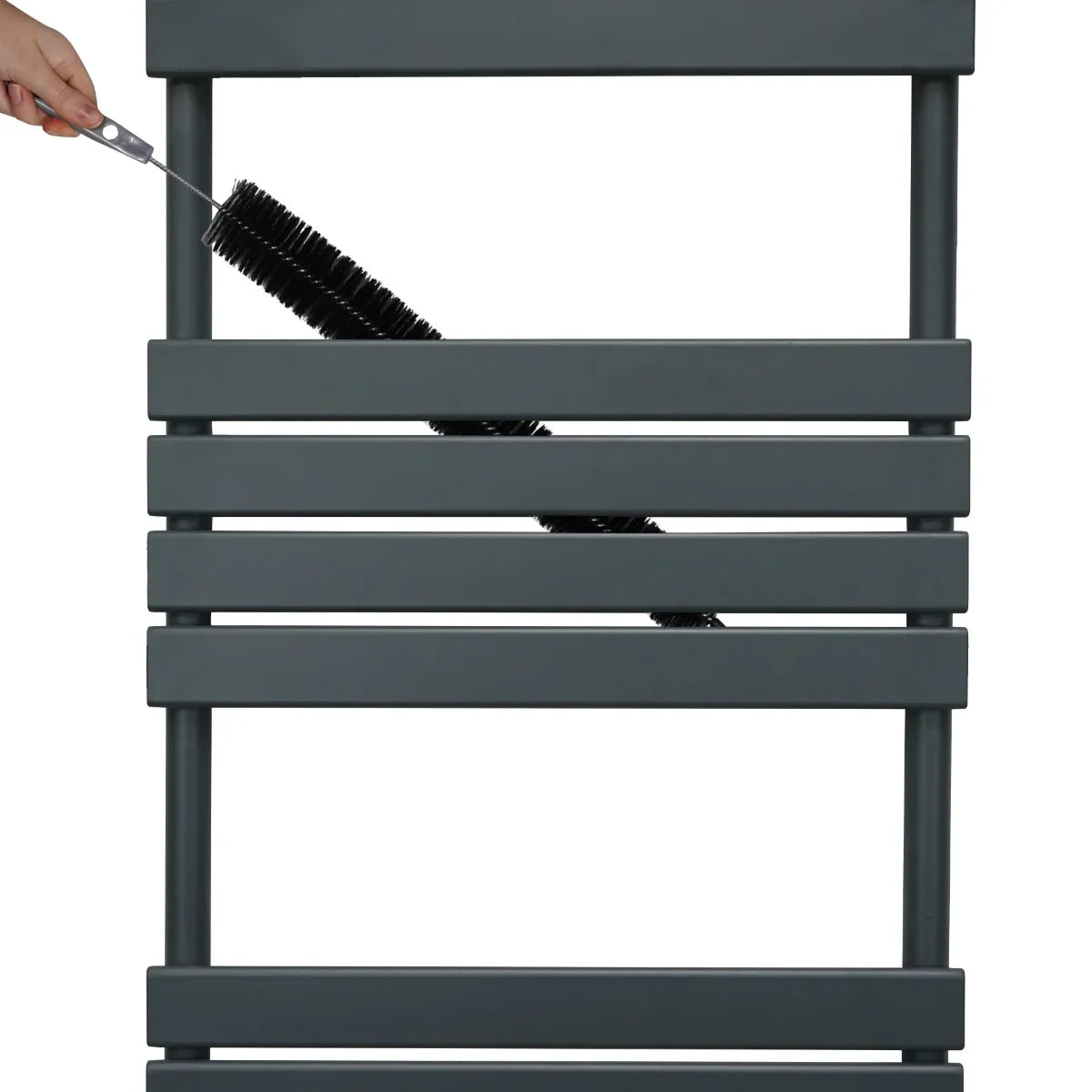 Anthracite grey flat panel towel radiator with sleek horizontal bars, featuring a hand holding a cleaning brush for maintenance