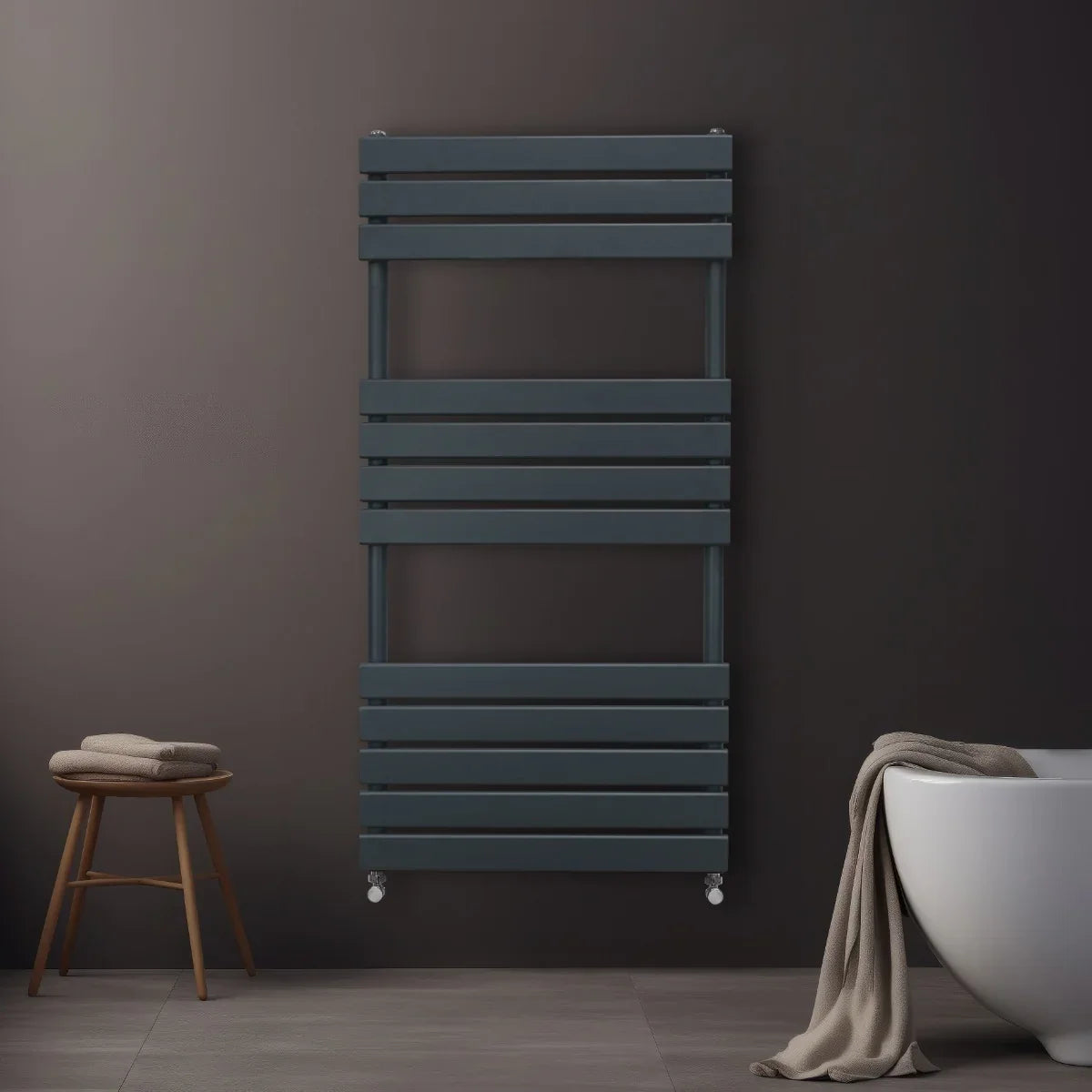 Flat panel towel radiator in anthracite grey, featuring sleek horizontal bars, mounted on a dark wall, with a cozy towel draped nearby