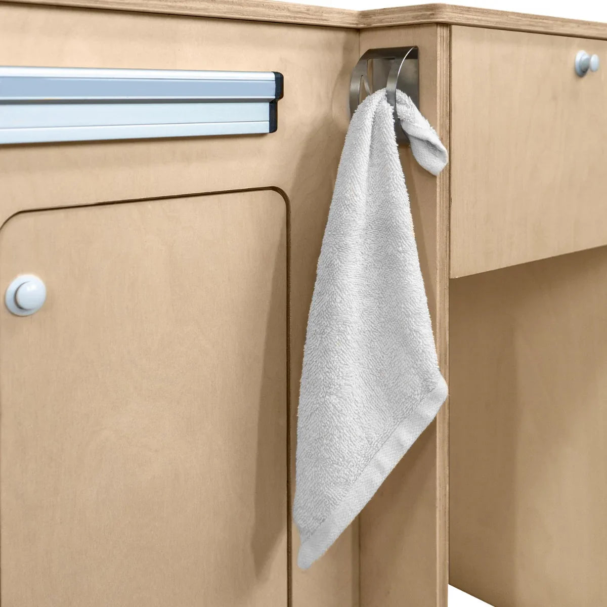 Light wood Camper Kitchen Pod with a silver compressor fridge, featuring a hanging gray towel for added convenience and functionality