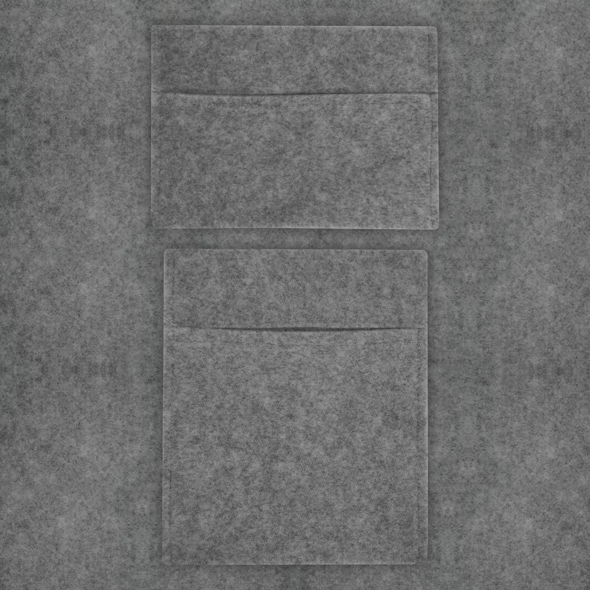 Smoke grey van carpet lining with two storage pouches, featuring a soft felt texture and a sleek, modern design for organization