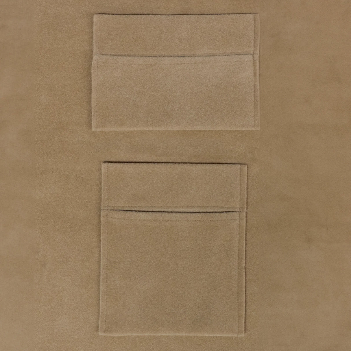 Beige van carpet lining with two soft storage pouches, featuring a smooth texture and practical design for organization
