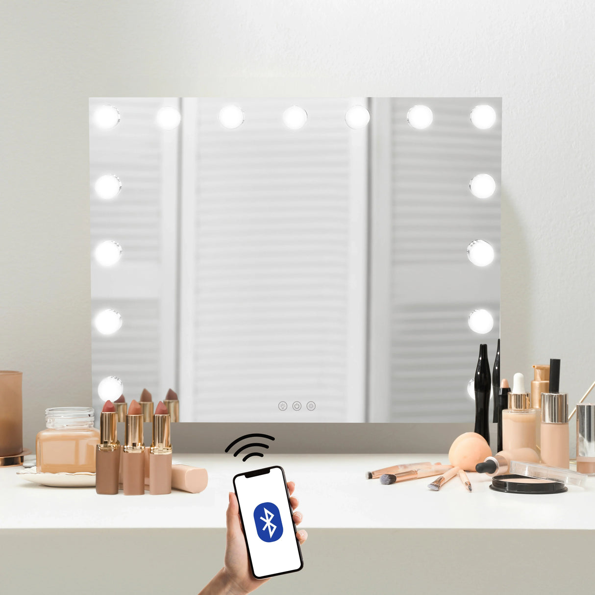 LED Bluetooth mirror, 58 x 46cm, features bright round bulbs, sleek glass surface, and a smartphone controlling feature, perfect for makeup application