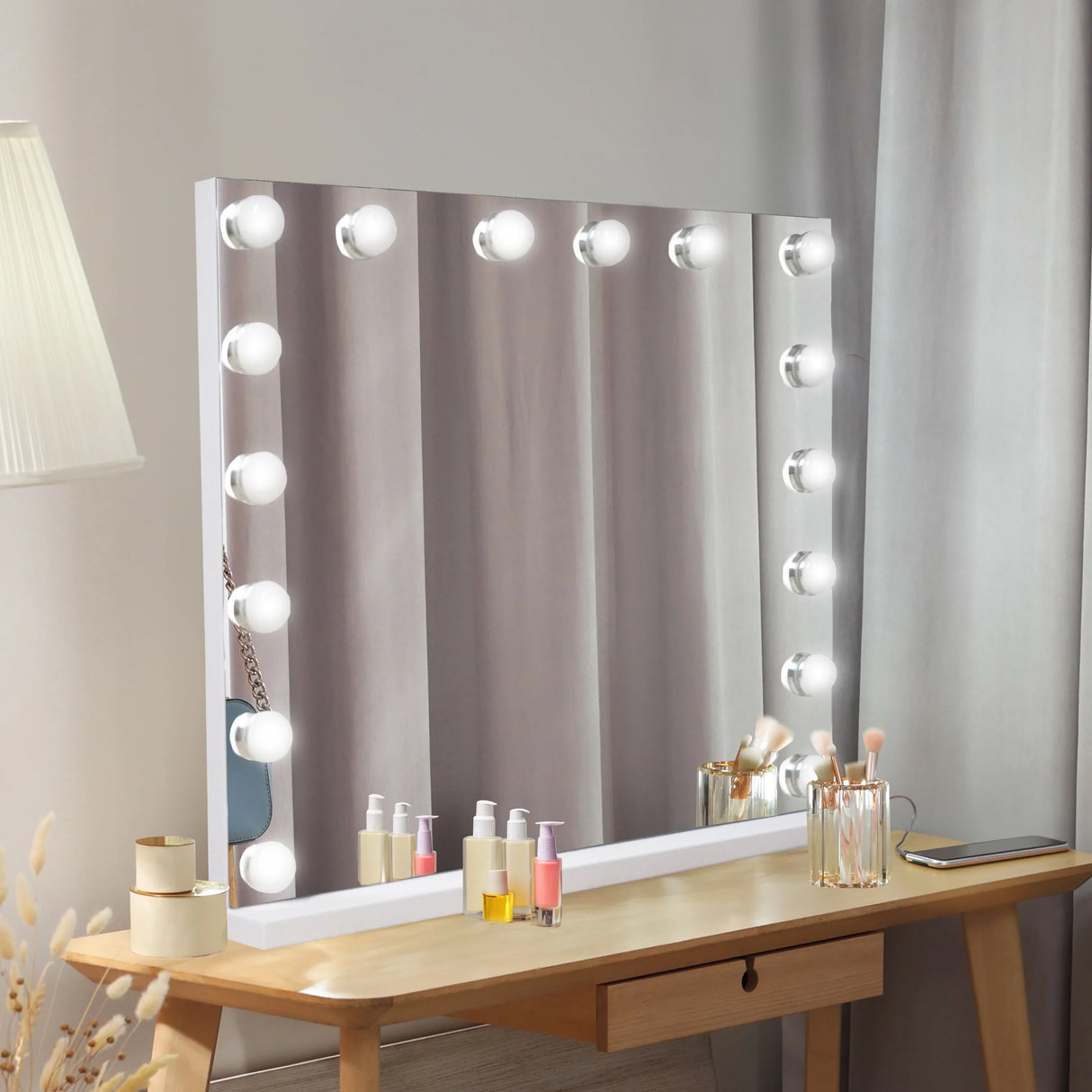 LED Bluetooth mirror, 80 x 60cm, features bright round bulbs, sleek white frame, and a stylish vanity setup with skincare products