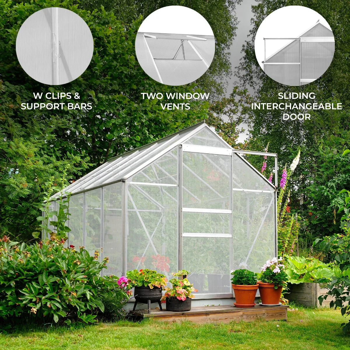 Silver polycarbonate greenhouse 6ft x 8ft featuring two window vents, sliding door, and surrounded by vibrant flowers and greenery