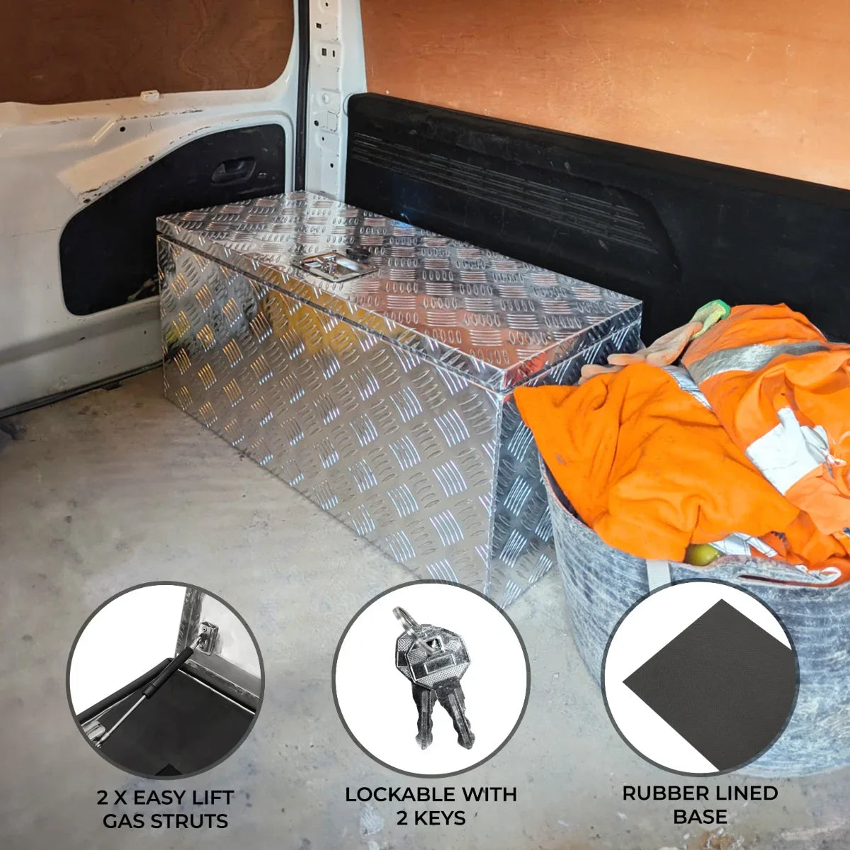 Large 70L aluminum tool box with a diamond plate finish, lockable with two keys, featuring easy lift gas struts and a rubber lined base
