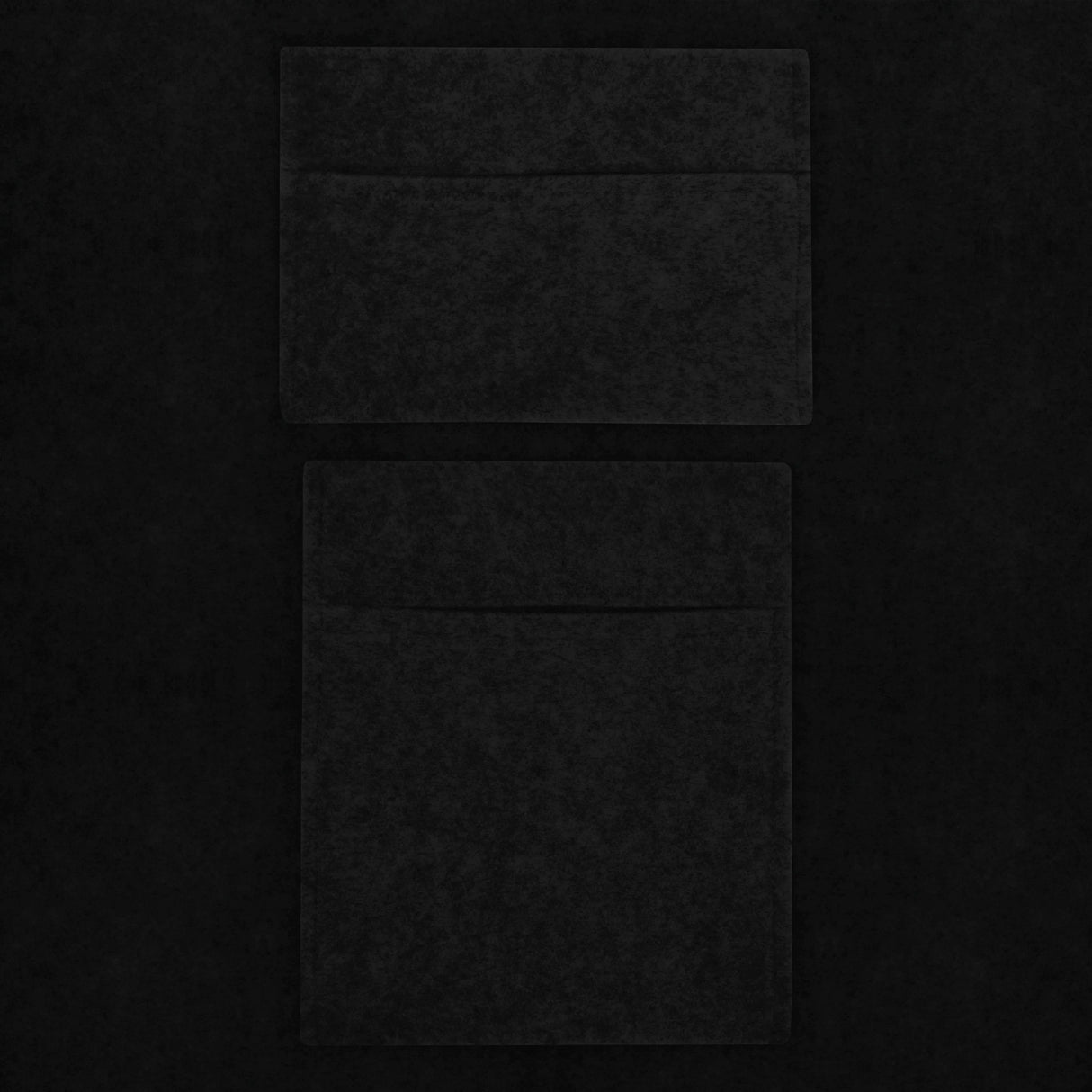Two black storage pouches with a soft texture, featuring a sleek design and smooth finish, ideal for organizing essentials