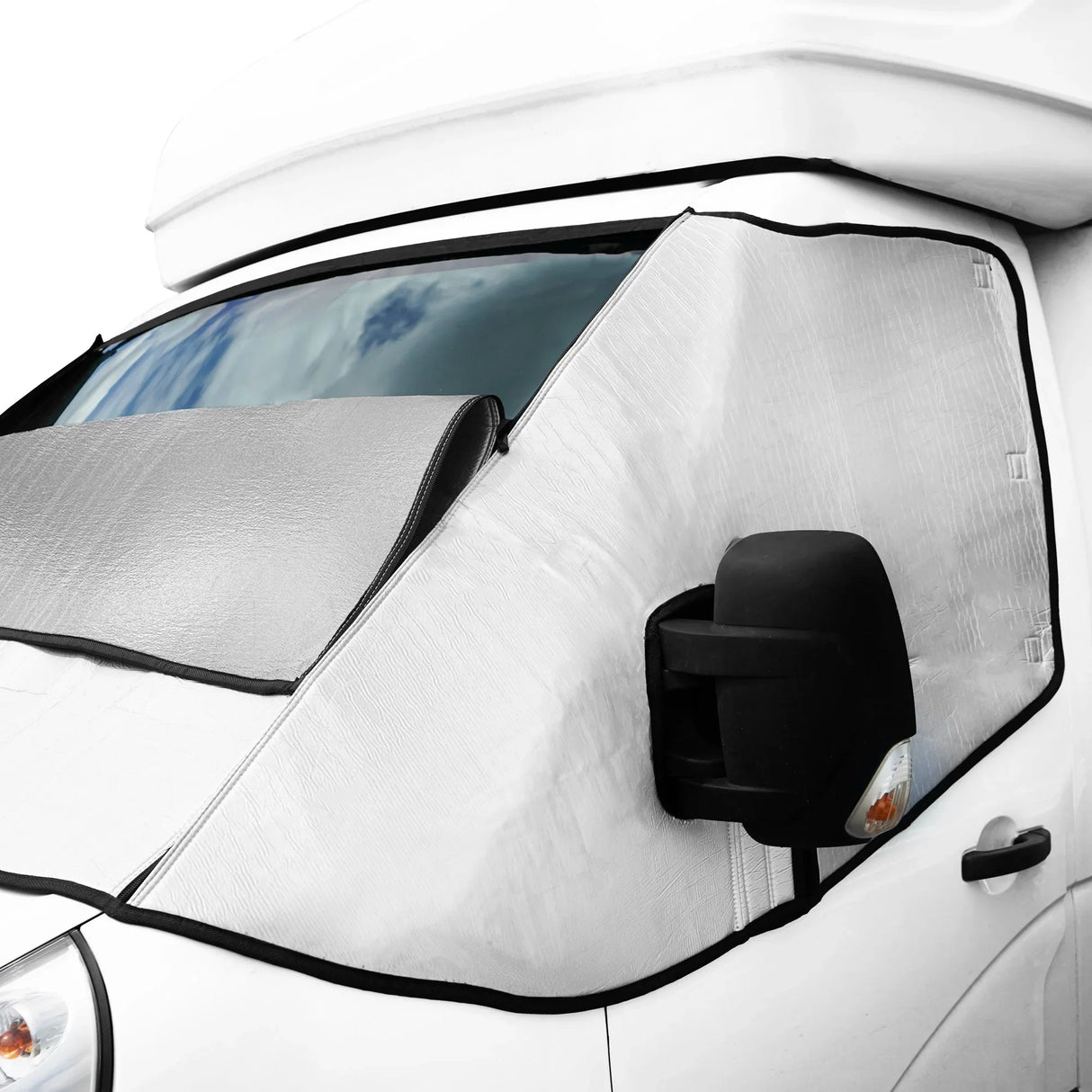 Motorhome screen cover featuring a reflective silver exterior, designed to fit snugly over the windshield and side mirrors for sun protection