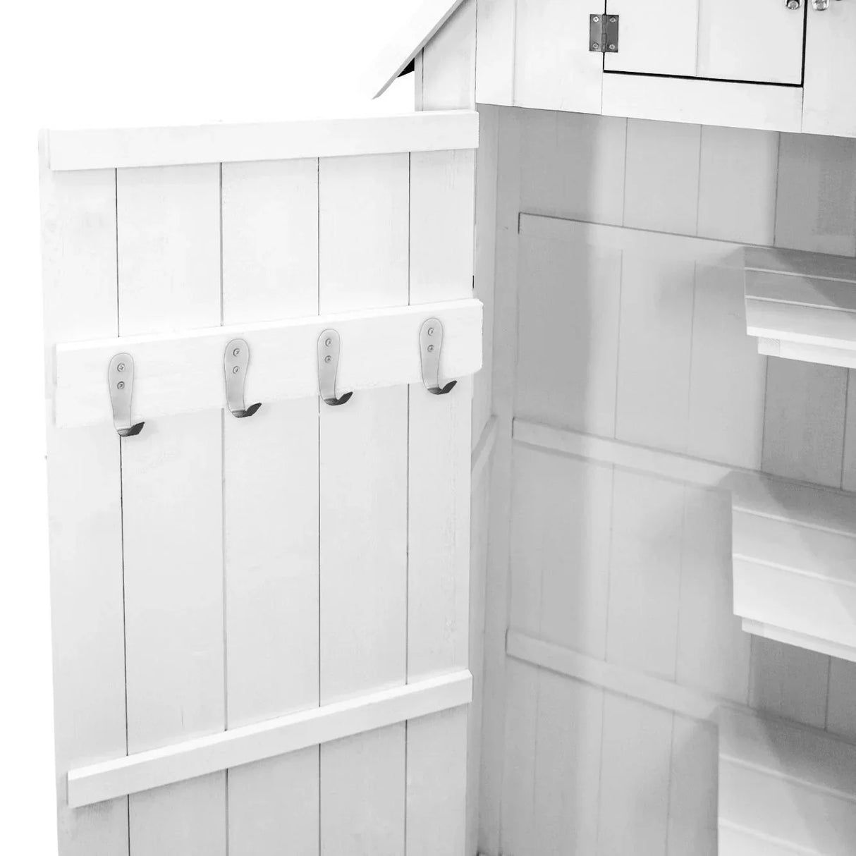 White wooden garden shed interior featuring four metal hooks on the door and spacious shelves for storage and organization