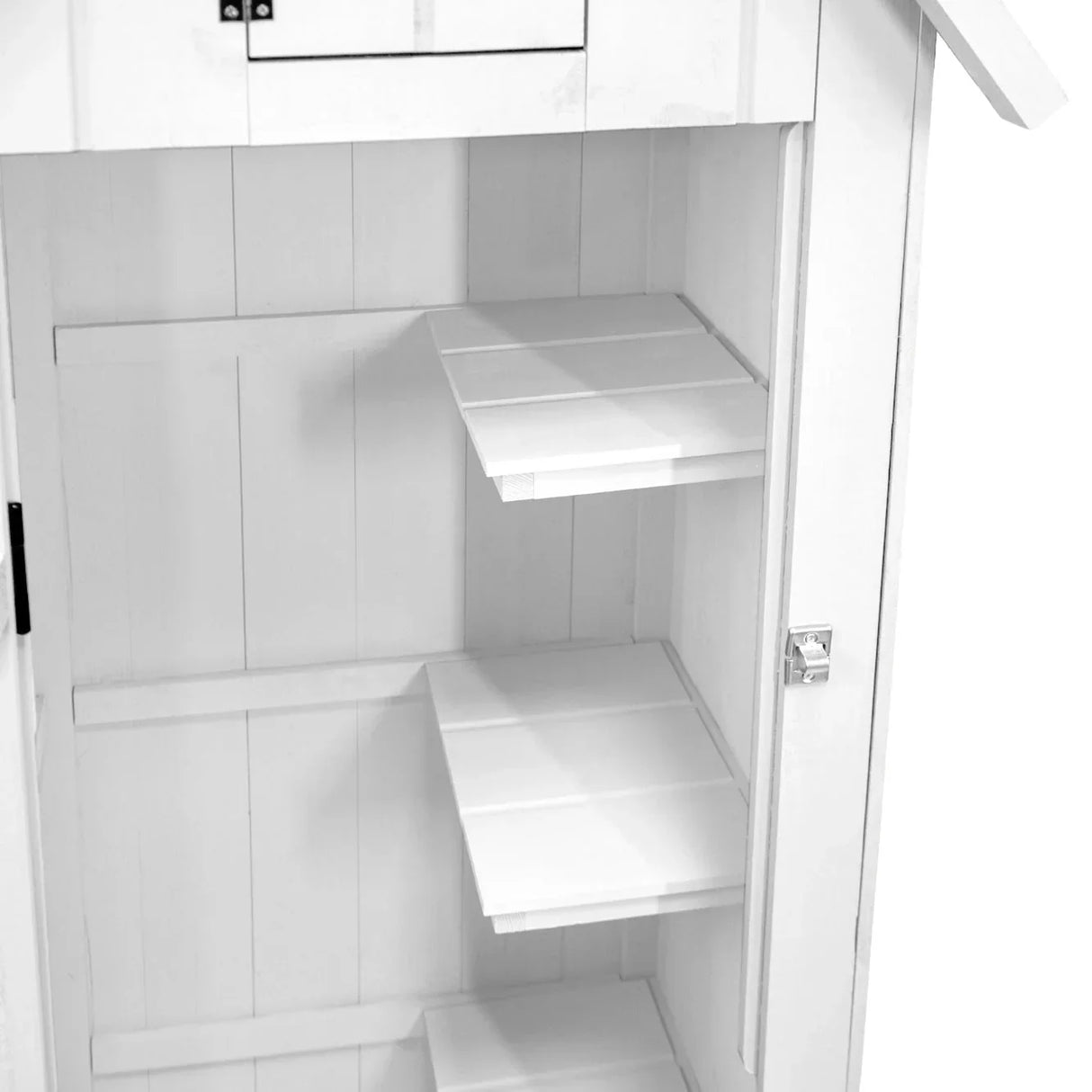 White wooden garden shed interior featuring three spacious shelves and a door with a small window for ventilation