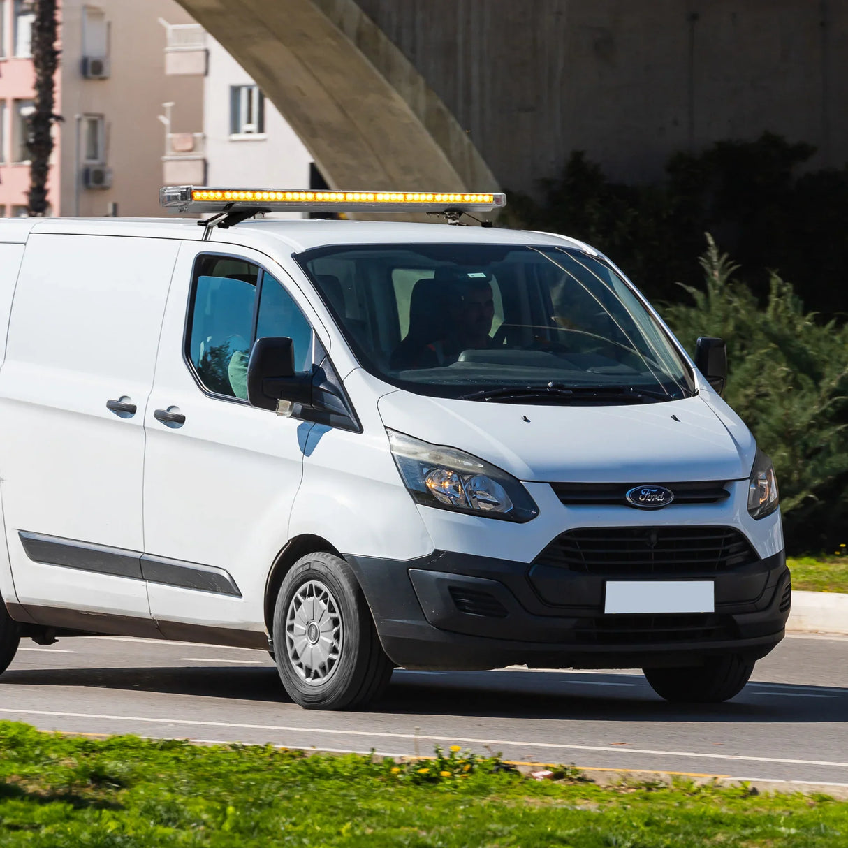 Amber Recovery Light 1200mm mounted on a white van, featuring a sleek design, bright amber lights, and a control panel for easy operation