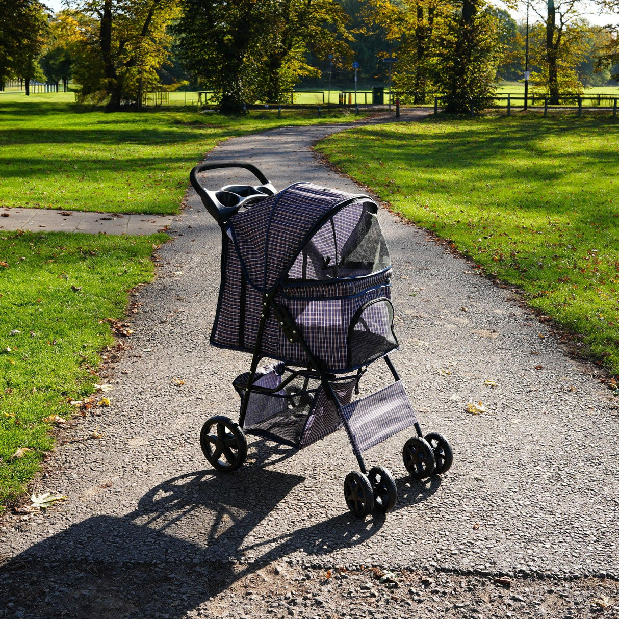 Blue tartan pet stroller with rain cover, featuring a spacious mesh canopy, sturdy wheels, and a lightweight frame, perfect for outdoor walks