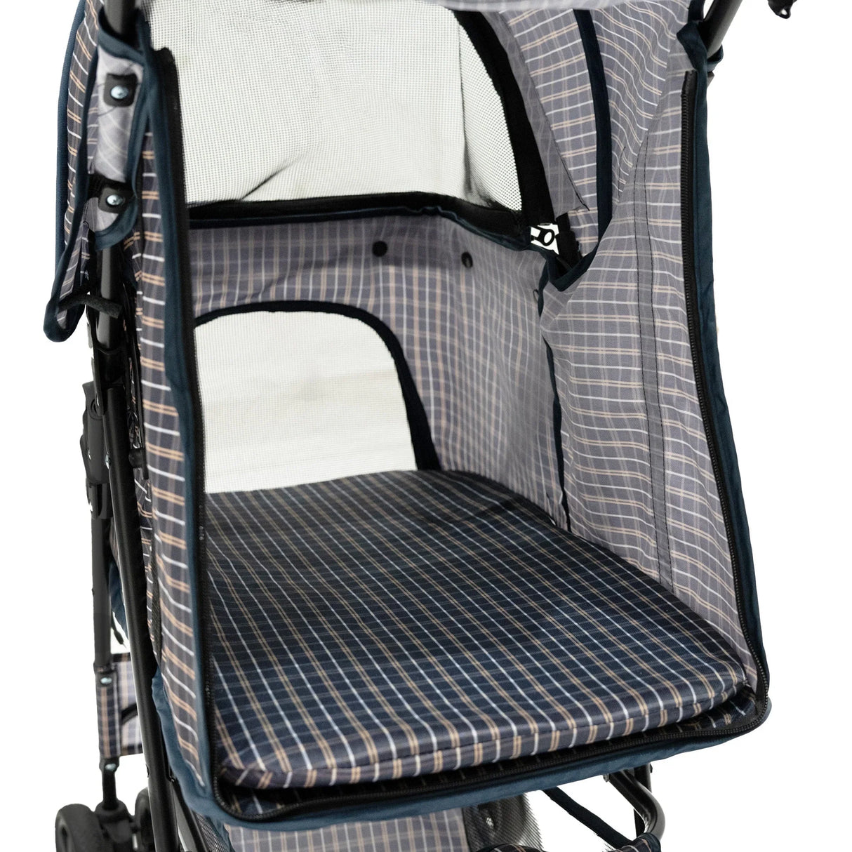 Pet stroller interior featuring a blue tartan pattern with a soft padded base, mesh ventilation, and spacious design for comfort