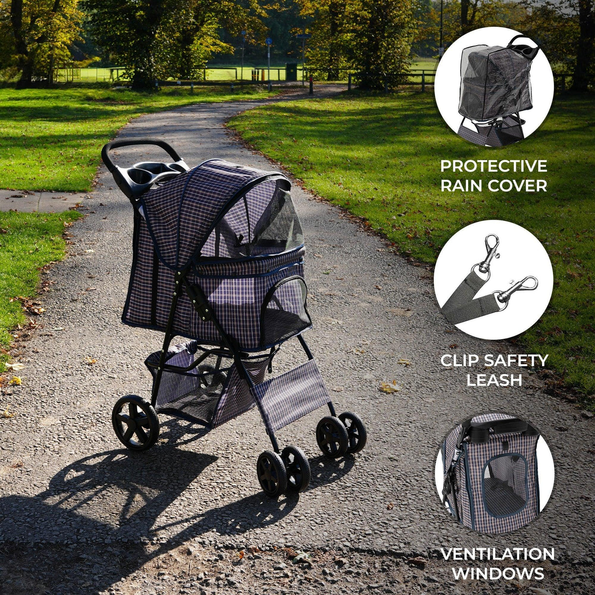 Pet stroller in blue tartan with a protective rain cover, featuring ventilation windows and a clip safety leash, on a sunny path