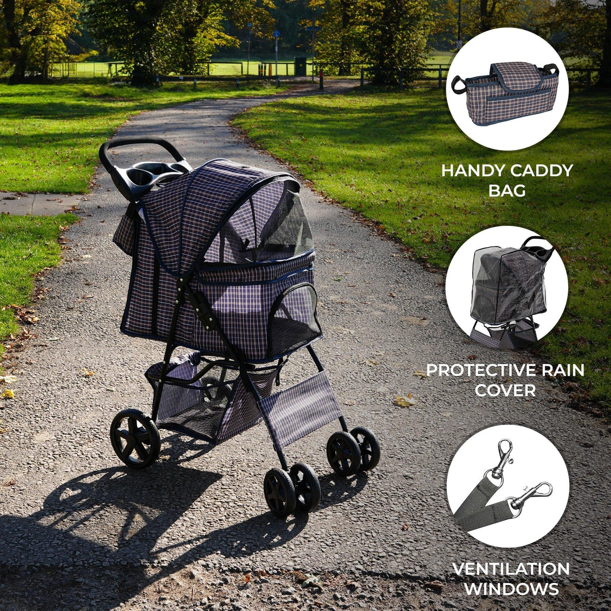 Pet stroller in blue tartan with a protective rain cover, caddy bag, and ventilation windows, set on a sunny park path