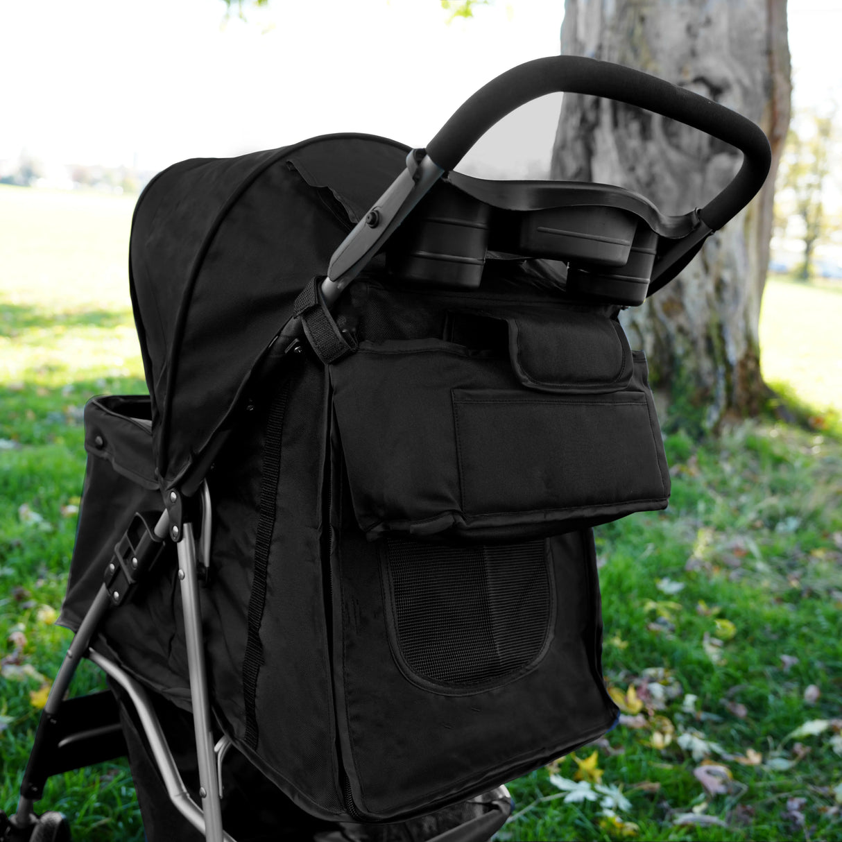 Black pet stroller caddy bag featuring a spacious front pocket, mesh ventilation, and sturdy handles, ideal for pet travel and storage