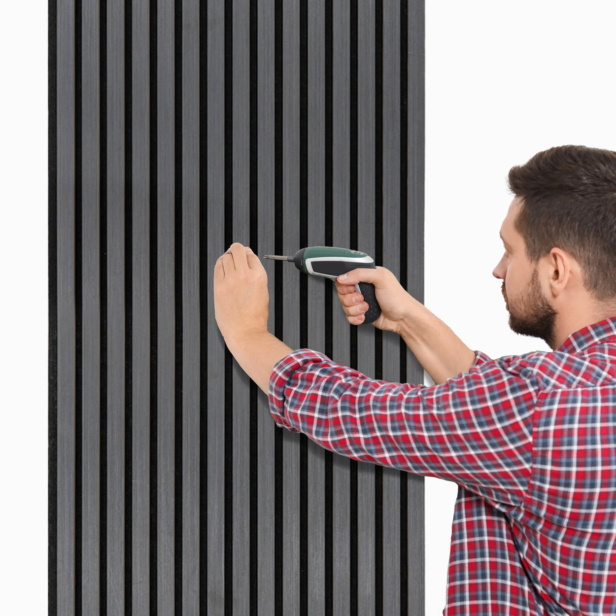 Anthracite grey acoustic slat wall panels being installed, showcasing vertical slats and a textured finish for sound absorption