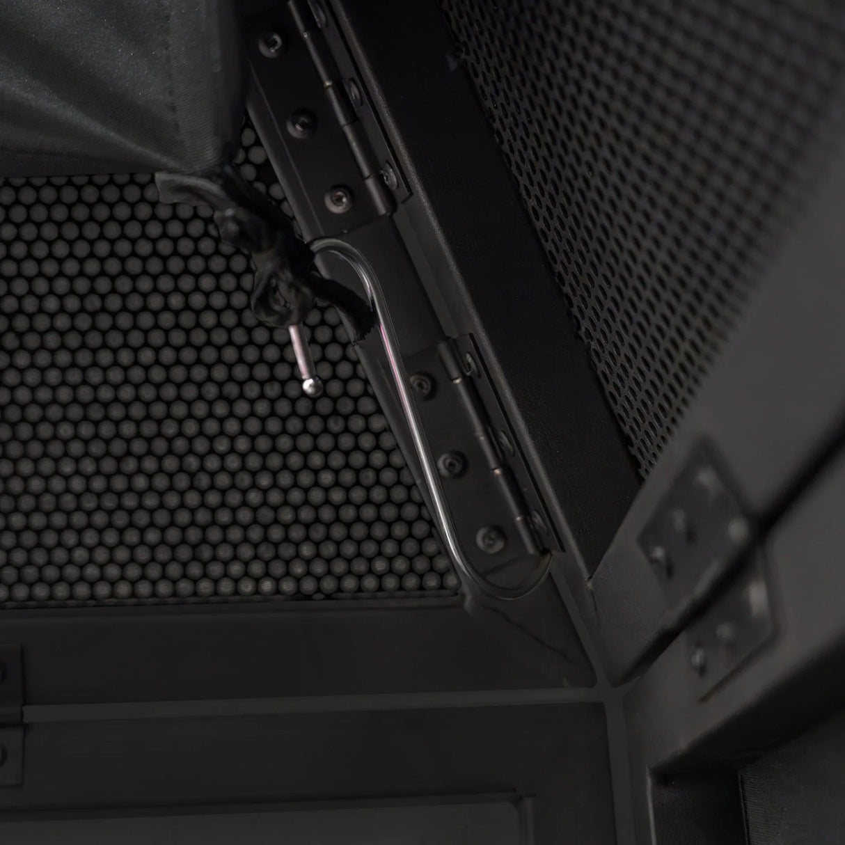 Close-up of the DJ Disco Booth Pro's sturdy metal frame, featuring a textured black finish and secure locking mechanism for stability