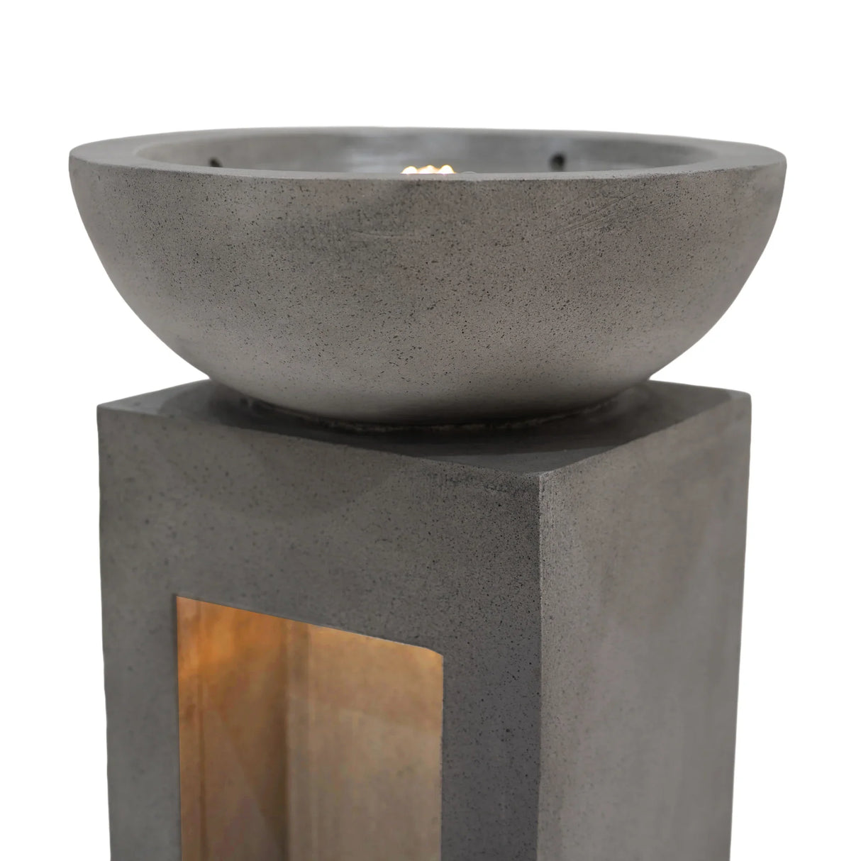 Serenity Falls electric water feature with a sleek gray concrete bowl atop a square pedestal, featuring a warm glow from the interior light