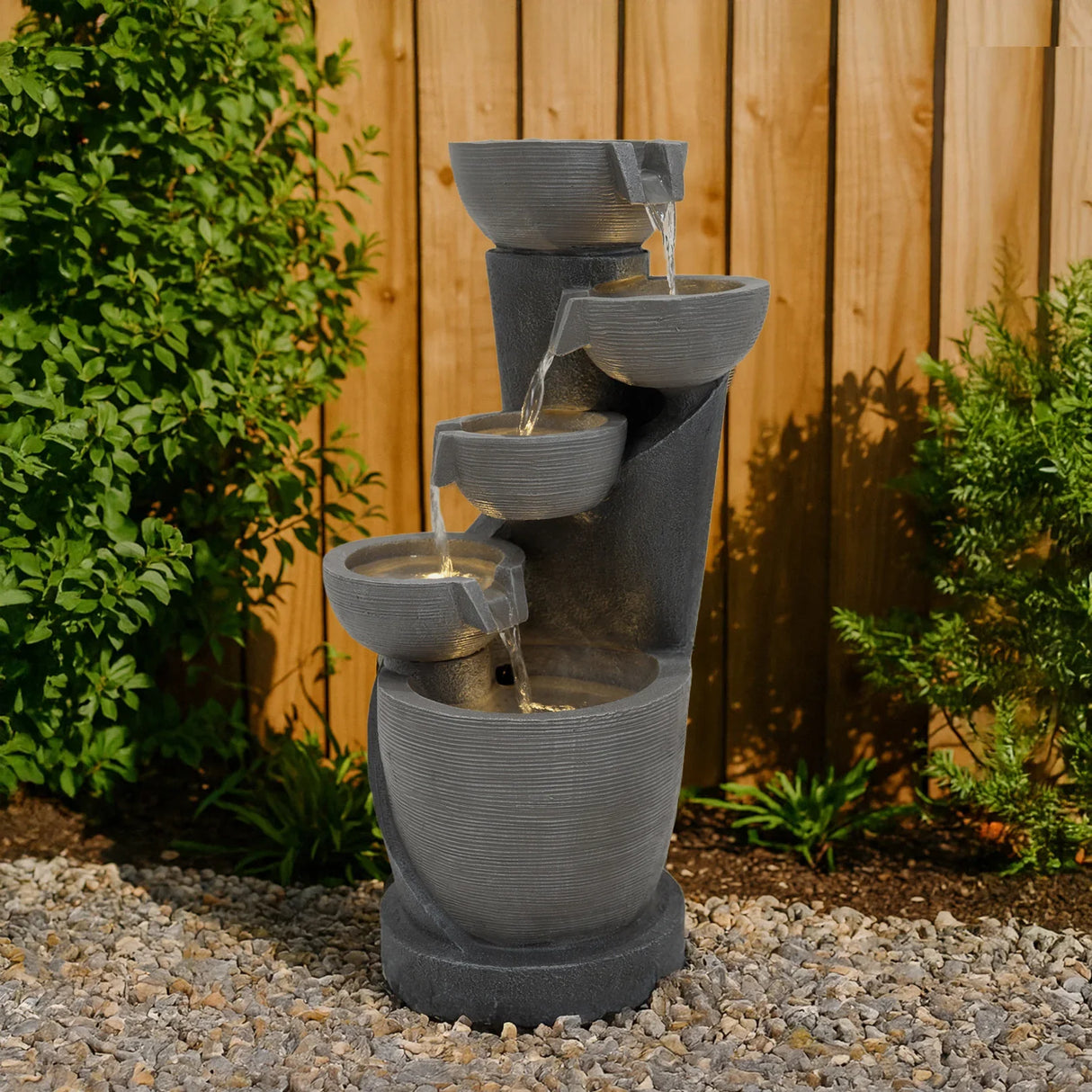 Electric Water Feature - Illusion Lagoon with a modern design, featuring cascading water flows, textured dark gray surfaces, and a sleek shape