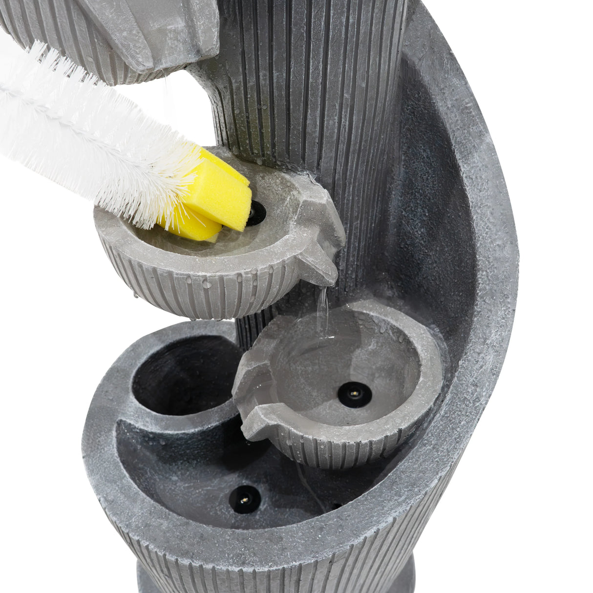 Electric water feature with spiral design, textured gray finish, and integrated cleaning brush for easy maintenance