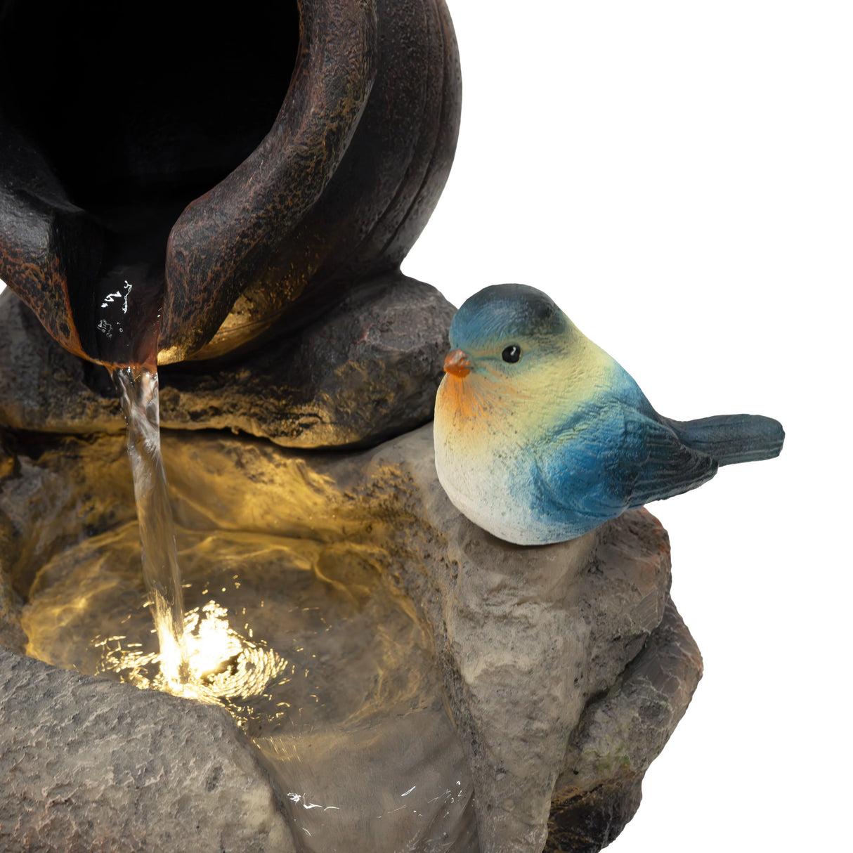 Electric water feature with a textured stone base, flowing water, and a colorful bird figurine perched nearby, enhancing outdoor decor