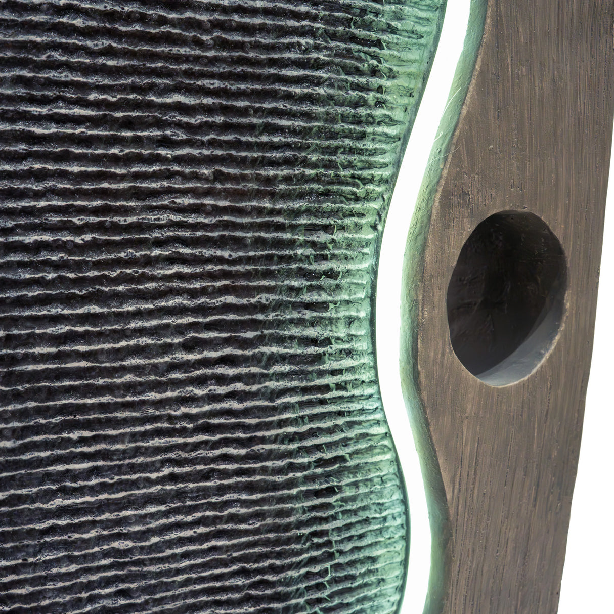Electric water feature Harmony Falls with textured slate surface, soft green backlighting, and a smooth, curved wooden frame