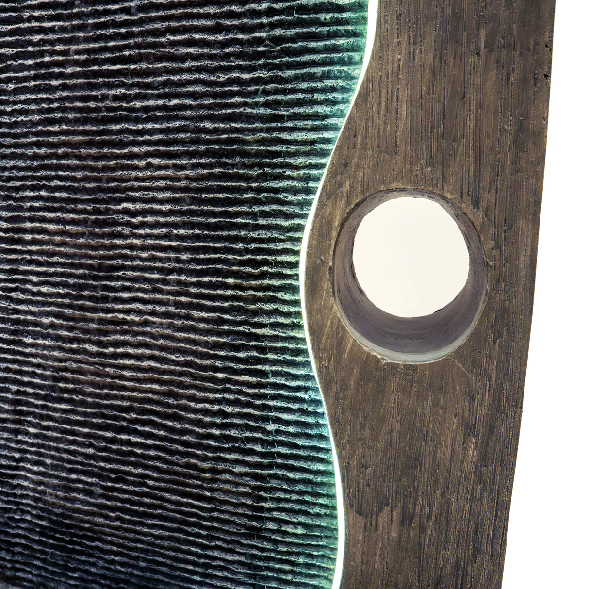 Electric water feature Harmony Falls with textured dark stone, illuminated edges, and a circular cutout for water flow