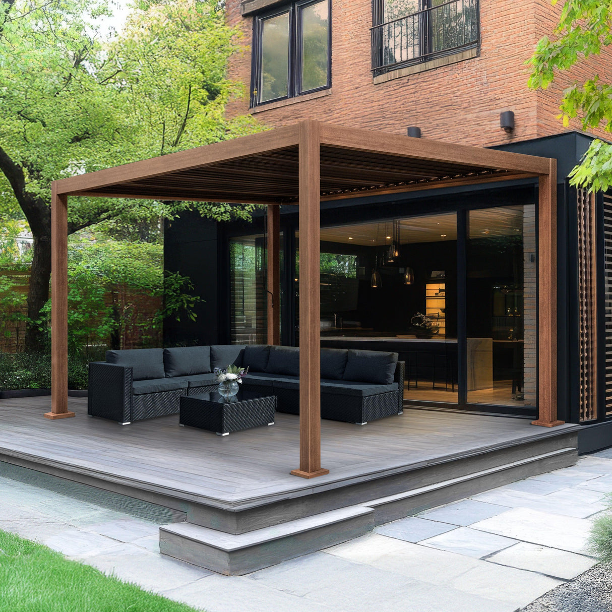 Wood effect aluminium pergola 3m x 3m with a sleek design, complementing a modern outdoor lounge area surrounded by greenery