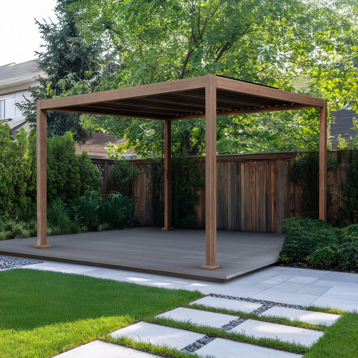 Wood effect aluminium pergola measuring 4m x 3m with a sleek design, set on a patio surrounded by lush greenery and stone pathways
