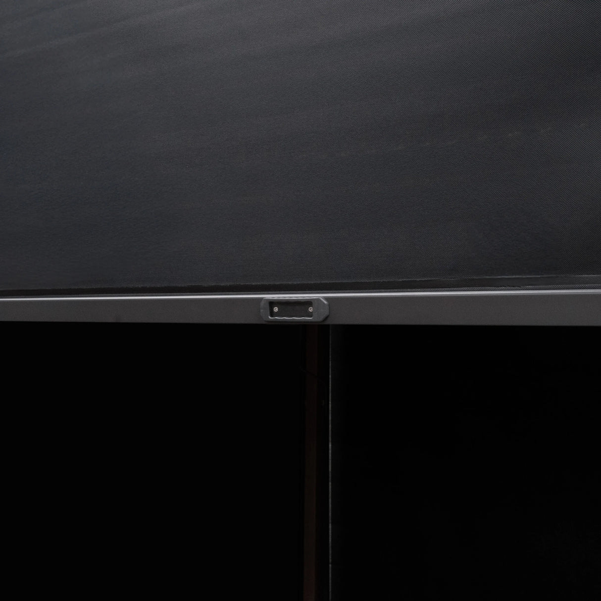 Close-up of the wood effect aluminium pergola's sleek black blinds, showcasing the smooth texture and modern design elements