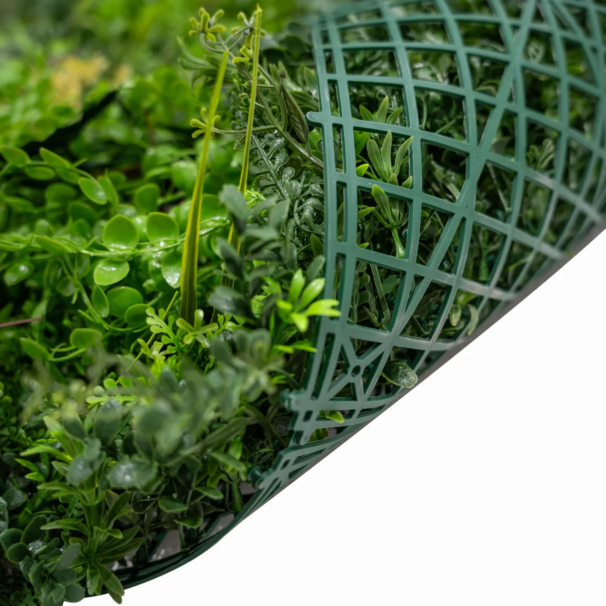 Alina Artificial Wall Tile in green, featuring a textured design with various faux plants, ideal for indoor or outdoor decor