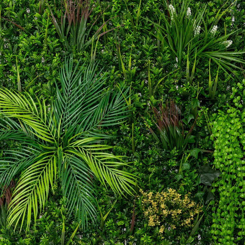 Lush green artificial wall tile featuring various plants, including palm leaves and ferns, ideal for enhancing indoor spaces