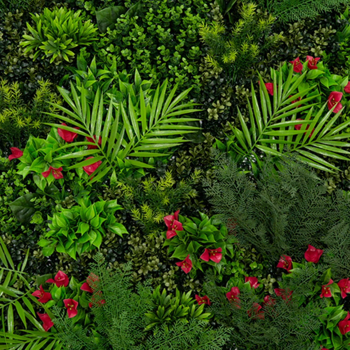 Mira Artificial Wall Tile features lush green foliage, vibrant red flowers, and varied textures, perfect for enhancing indoor spaces